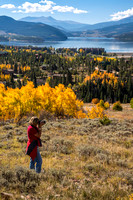 Woman Taking Pictures of Fall Colors